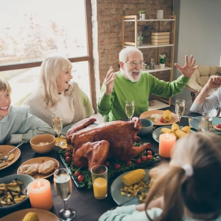 Illustration depicting students discussing the significance of Thanksgiving and learning and practicing using prepositional phrases of place in an English lesson.